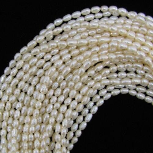 New 5-6mm white freshwater pearl rice/Oval beads 14"