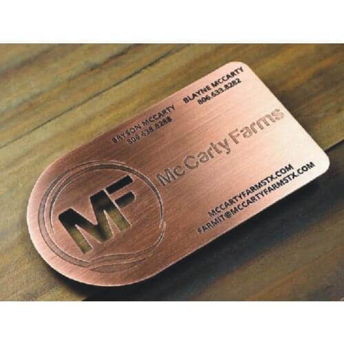 Hole punched brushed red bronze metal business cards