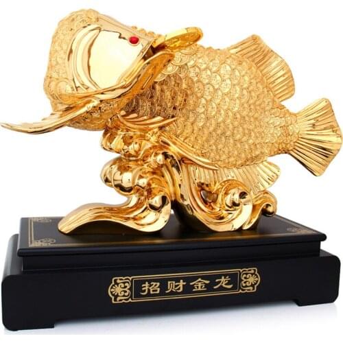 THE GOLD DRAGON FISH IS A LARGE LIVING ROOM TV CABINET ARTS AND CRAFTS COMPANY OFFICE HOME DECORATION FAMILY DECORATIONS STATUE