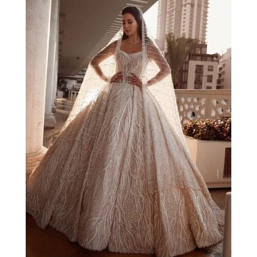 Sparkle Ball Gown Wedding Dresses Charming Backless Robe de mariée Sexy Spaghetti Straps Sequins Princess Bride Gown