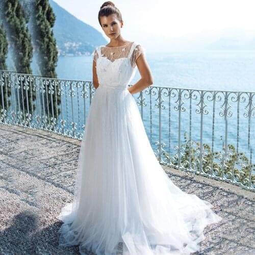 Cap Sleeve Scoop Appliques Lace Bow Sash Buttons Tulle A-Line Wedding Dress 2021 Vestido De Noiva Bridal Gown