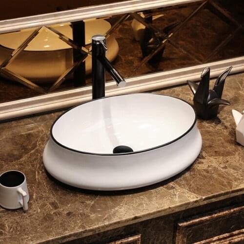 Creative Nordic Art Oval-shaped white porcelain Ceramic Wash basin bathroom sink