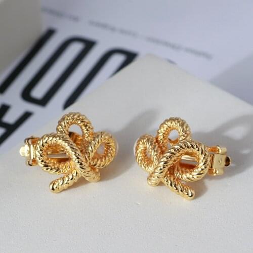 European and American style simple designer bright face gold color knot bow shape Earrings ear clip advanced gift lady