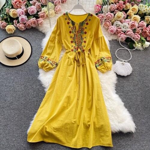 The new womens solid-color embroidered dress bohmian lantern sleeves windy long dress womens wear