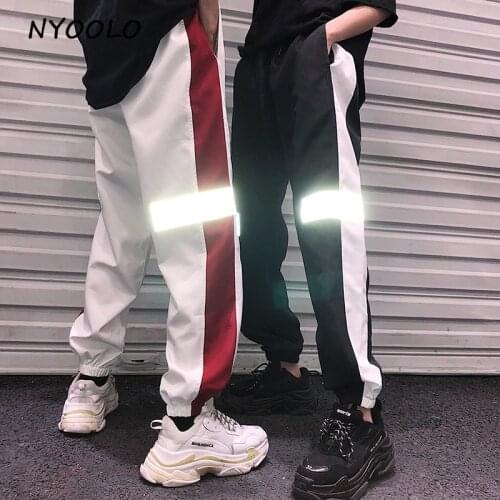 NYOOLO 2018 Harajuku style hip hop pants Reflective patchwork elastic waist full length pants women/men streetwear