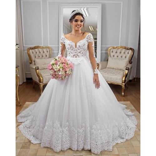 Elegant Illusion Tulle Sweep Train Ball Gown Wedding Dresses Long Sleeve Lace Beaded Bridal Gowns With Appliques