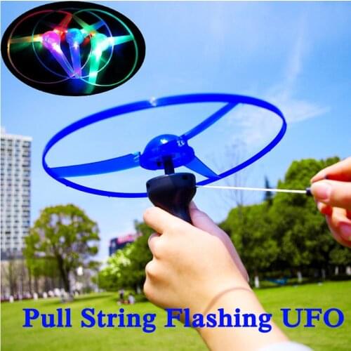 Outdoor Hot Sale Glow In The Dark Flashing Toys Funny Pull String UFO LED Light Up Flying Disc Colorful Kids Toys For Children