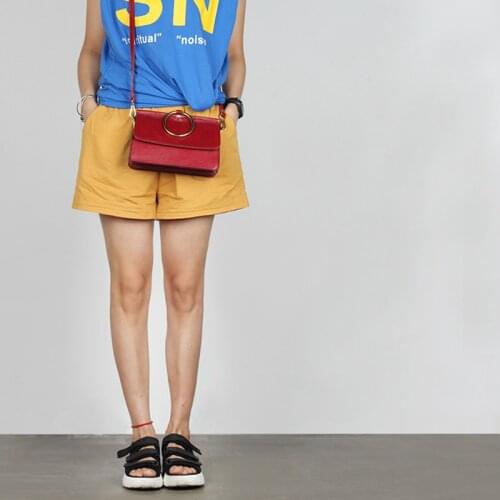 The latest fashion in 2021 is a versatile leather handbag for women with one shoulder and a cross ring