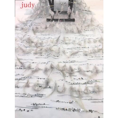 Stock RFJ# Silver gray sequins with beaded embroidery and feather tassels are used in fashion fabrics for wedding dress dresses