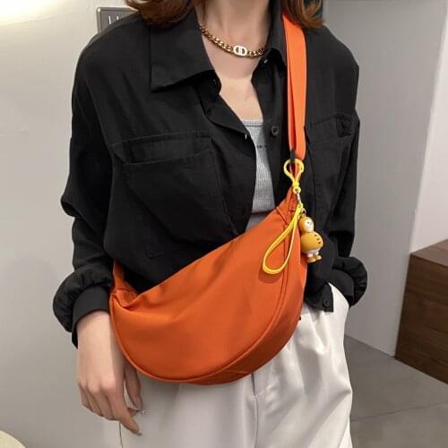 Nylon canvas dumpling bag female new trendy fashion saddle bag wild ins messenger bag portable storage pouch with cute pendant