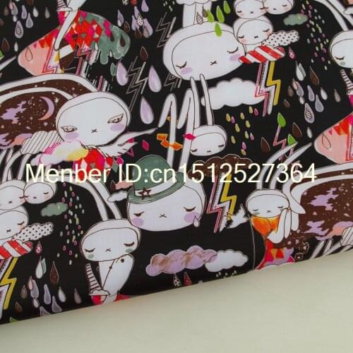 PVC coated waterproof fabric - Bunny Rabbit in the rain on black background (WF314)