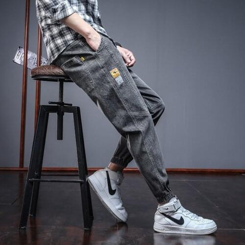 Spring and autumn 2021 Fashion new mens denim trousers Korean fashion loose-footed cropped trousers tide brand young men