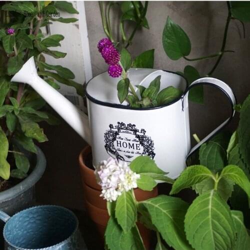 Handcrafted cream shabby chic metal watering can