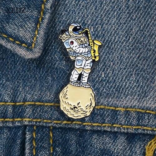 XEDZ Fun astronaut blowing saxophone enamel pin fashion cartoon childrens denim clothes lapel pendant jewelry gift on space pla