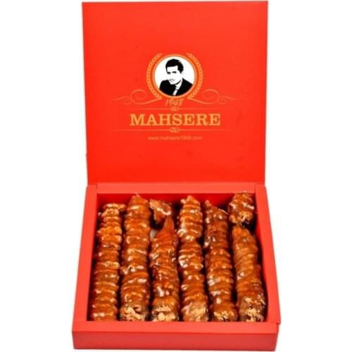Delicious sweet highland sausage with grape molasses and walnuts. Sausage Turkish Delight. sweet product. walnut inside