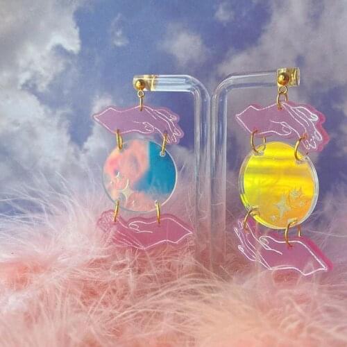 The celestial The Moon and My Magic Hands Moon Phase Earrings