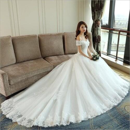 LOVSKYLINE Luxury Bling Women Wedding Dresses Ball Gown With Long Tail White Ivory Color Embroidery Lace Edge Short Sleeve