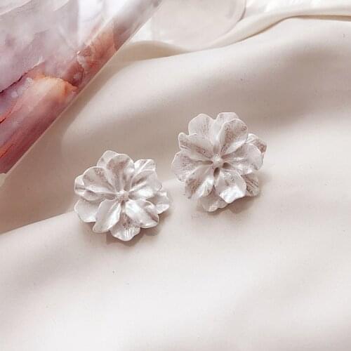 Dominated 2019 stereo carve patterns flowers designs on Resin earrings Fashion temperament contracted Women Stud earrings