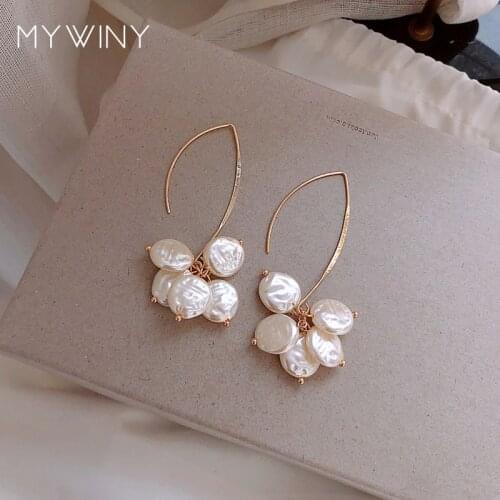 MYWINY Unique Korean ear hook, senior sense shell earrings, temperament ins web celebrity niche earrings for women