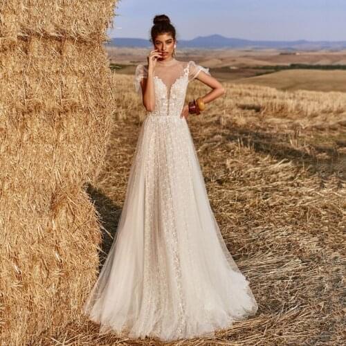 Thinyfull New Arrival Backless Tulle Wedding Dresses Cap Sleeve O Neck A Line Bride Dresses Simple Lace Appliques Bridal Gown