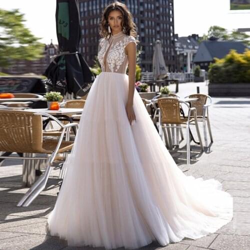 Cap Sleeve Lace Tulle Wedding Dress Appliques Illusion A-Line Princess Bridal Dress Vestido de Noiva Backless Wedding Gown