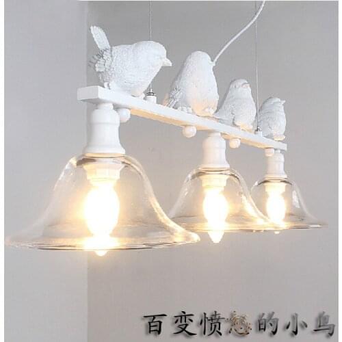 The new Northern European pendant light coffee shop warm modern simple bar glass pendant lamp American pastoral village lights