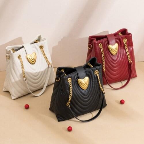 Womens bag fashion personality shoulder slung bucket rhombic chain Baotou layer cowhide leather womens diagonal cross bag sh11