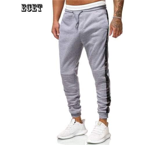 New European and American trend men’s trousers, joggers, fitness sportswear stitching fashion casual pants