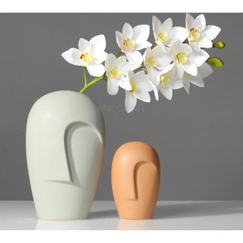 New creative Nordic modern minimalist style ceramic vase with human face, personalized decoration in the club hall