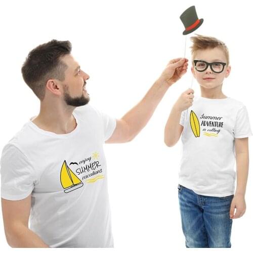 Summer adventure goes on in family attire with dad and boy short sleeved relaxed enjoy a cartoon sailboat with round collar