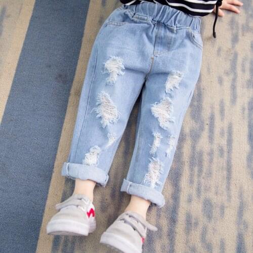 2021 spring and autumn new style boys and girls fashion personality hole beggar jeans baby solid color versatile loose pants