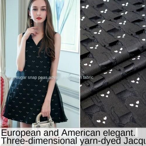 Autumn and winter elegant black and white cat yarn-dyed jacquard fabric/European and American dress windbreaker jacket fabric