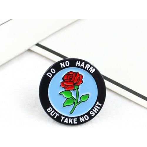 Red rose brooch tells people to love and not hurt others to warn people to talk about bad but not to hurt people behind