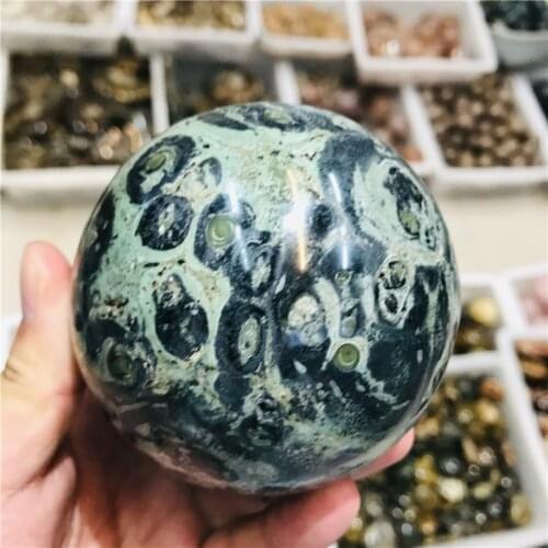 Natural malachite crystal balls are used in home decoration and feng shui treatment