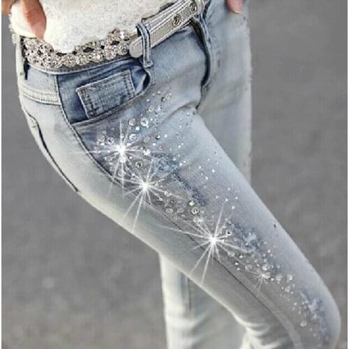 Richkeda Store New 2021 Women Diamond Drilled Hole Jeans Woman Pencil Pants Women Jeans Ripped Denim Trousers With Rhinestone