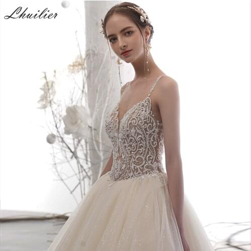 Lhuilier A-line V Neck Backless Tulle Wedding Dresses 2020 Luxury Sleeveless Crystal Beaded Chapel Train Champagne Bridal Dress