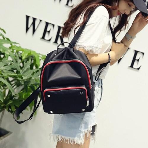 2021 new leisure fashion backpack front pocket four nails trend student schoolbag nylon travel bag