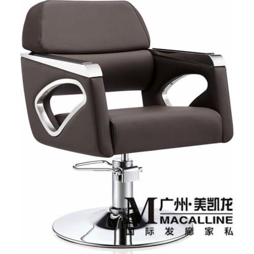 European hairdressing chair solid wood cutting. Luxury Italian hair salon chair. The new barbers chair