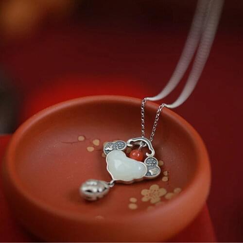 Designer original new retro ethnic wind auspicious natural Hetian jade hollow peony tassel pendant necklace ladies accessories