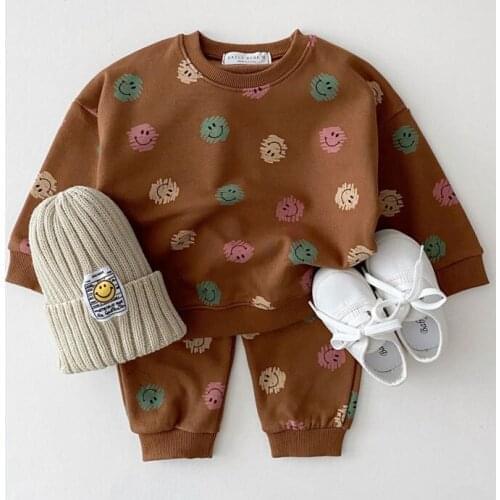 2021 spring and autumn girls clothes, childrens cartoon smiley casual sports shirt, boys trousers, two-piece cotton hat set