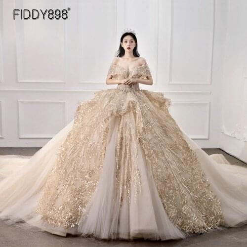 Golden Dubai Ball Gown Wedding Dress Off-shoulder Bride Dress Luxury Sequins Long Train Beaded Wedding Dresses for Women 2020