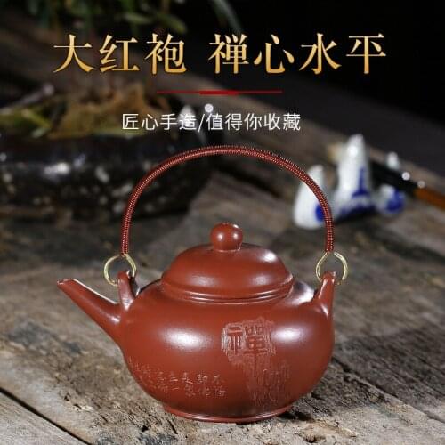 Direct selling raw material Dahongpao famous brand genuine manual horizontal beam copper handle purple clay teapot