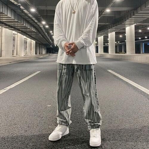 Spring summer new niche design trousers mens retro irregular vertical strips zebra pattern loose washed straight casual jeans
