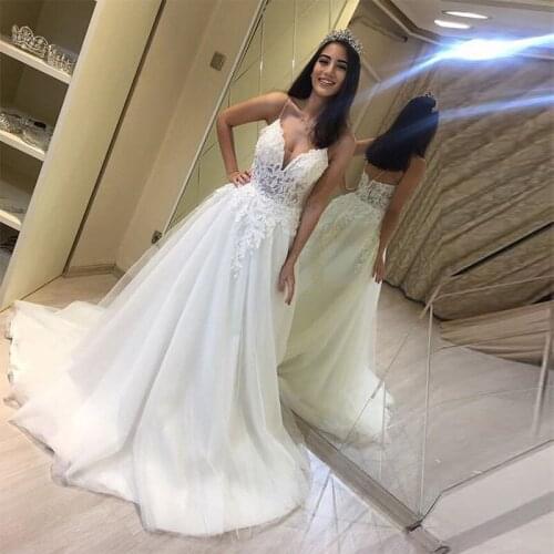 Charming A-Line Illusion Wedding Dresses V-neck Spaghetti Straps Appliques Bridal Gowns Floor Length White Ivory Wedding Gowns