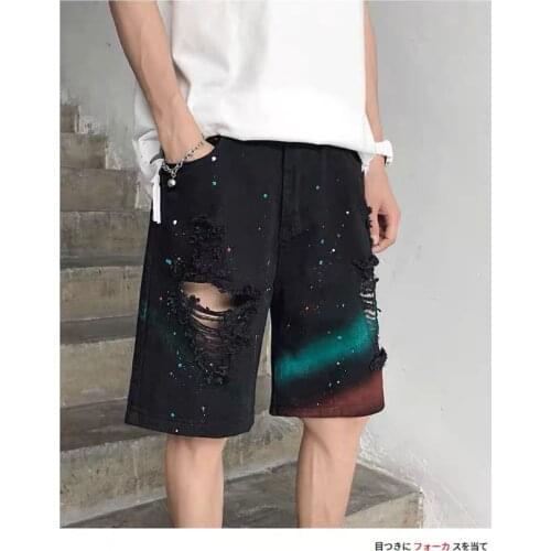 Tie-dyed denim shorts mens trend paint dot splash ink design sense beggar hole five pants high street pants