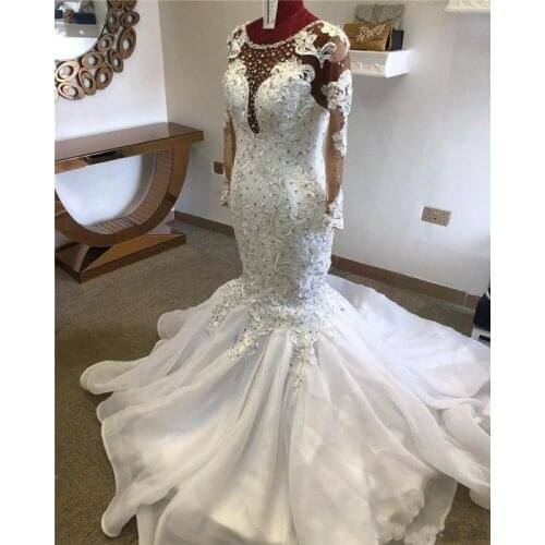 Luxury Mermaid Wedding Dresses Jewel Neck Illusion Lace Appliques Crystal Beaded Long Sleeves Court Train African Bridal Gowns