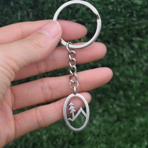 12pcs Simple fashion oval Snow Mountain Pine tree keychain Nature Jewelry Christmas Gift