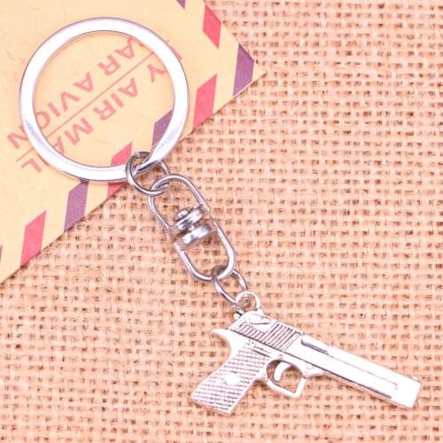 New Fashion Keychain 45*20 mm gun browning pistol Pendants DIY Men Jewelry Car Key Chain Ring Holder Souvenir For Gift