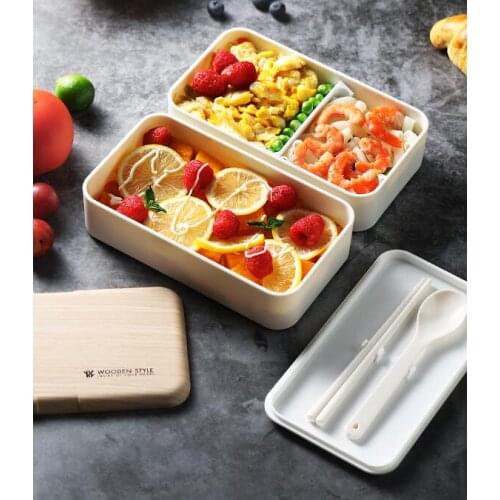 Double compartment lunch box for office workers can be heated by microwave oven