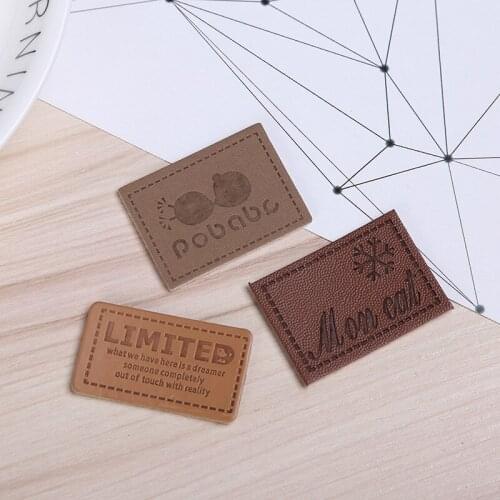 2019 factory professional custom embossed clothing pu genuine faux leather label with your own design